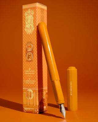 The Carousel Fountain Pen - Hearty Harvest | Ferris Wheel Press with orange cap and silver nib next to patterned box