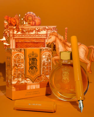The Carousel Fountain Pen - Hearty Harvest | Ferris Wheel Press in warm orange with detailed packaging and ink bottle