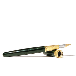 The Joule Fountain Pen - Miss Cora Lynn | Ferris Wheel Press with dark green brass body and gold details angled on white background