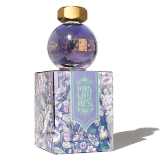 Moonbeam Meadows | 20ml Ink | Ferris Wheel Press in a round purple glitter bottle with gold cap on floral box