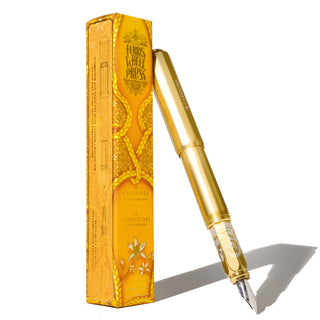 Limited Edition | Plaited Gold Tress Fountain Pen | Ferris Wheel Press resting beside golden embossed packaging