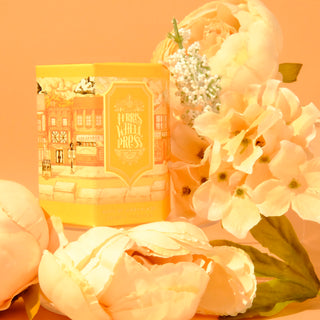 Main St. Marmalade 85ml Ink Ferris Wheel Press in decorative yellow packaging with soft white flowers