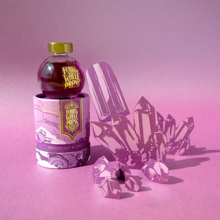 Grape Ice Pop 85ml Ink by Ferris Wheel Press with gold cap and purple crystal-themed packaging