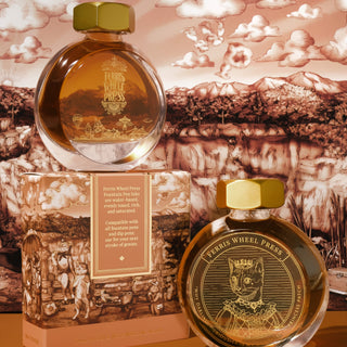 Terracotta Canyon | 38ml Ink | Ferris Wheel Press bottle with golden cap and detailed artistic packaging background