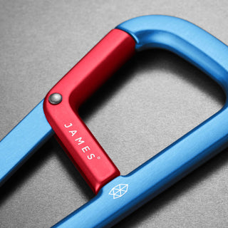 James The Hardin Carabiner by The James Brand in anodized blue and red aluminum close-up