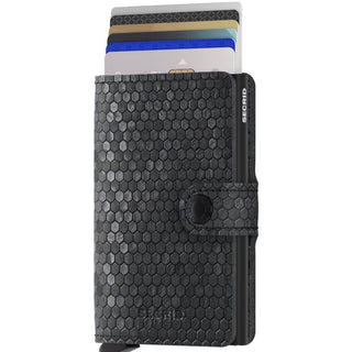 Secrid Miniwallet Hexagon in black leather with hexagonal texture and multiple cards partially visible