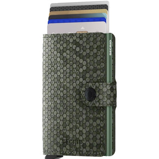 Secrid Miniwallet Hexagon with green hexagonal textured leather and multiple cards partially extended