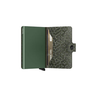 Secrid Miniwallet Hexagon in green with hexagonal patterned leather and card partially visible inside