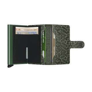 Secrid Miniwallet Hexagon in green leather featuring a hexagon pattern with card slots and cash compartment open