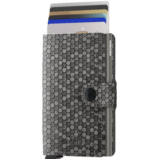 Secrid Miniwallet Hexagon in grey leather with embossed hexagon pattern holding multiple cards upright