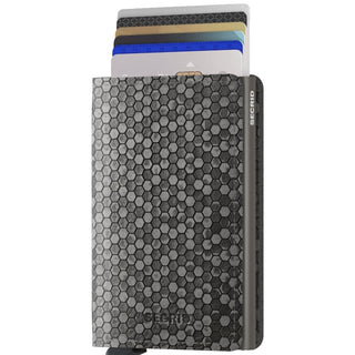 Secrid Slimwallet Hexagon with textured hexagonal pattern and cards fanned out in metallic gray leather case