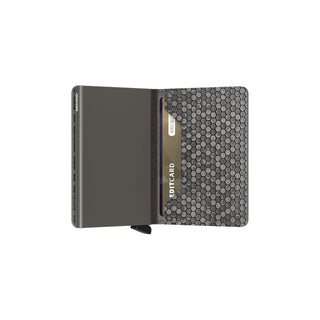 Secrid Slimwallet Hexagon open showing grey hexagon leather texture and card holder with a card inserted