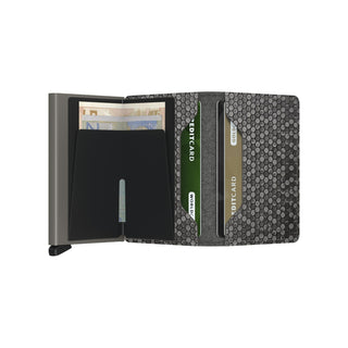 Secrid Slimwallet Hexagon open showing black cardholder and textured hexagon leather interior with cards and cash