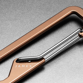 James The Holcombe Carabiner in bronze titanium with polished stainless steel spring latch close-up view