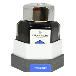 Caran d'Ache Fountain Pen Ink Bottle 50 ml in Idyllic Blue with hexagonal glass design and metal cap