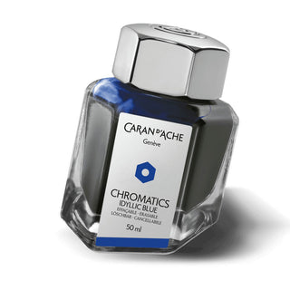 Caran d'Ache Fountain Pen Ink Bottle 50 ml in vivid blue with hexagonal glass design and metal cap