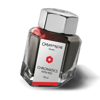 Caran d'Ache Fountain Pen Ink Bottle 50 ml in hexagonal glass with shiny metal cap and red ink visible