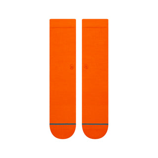Bright orange STANCE ICON CREW SOCKS with subtle logo and contrasting thin black line near toes