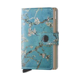 Secrid Miniwallet Art featuring blue floral Italian calf leather and secure snap closure design