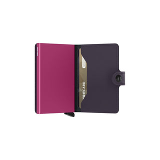 Secrid Miniwallet Matte in purple with black leather interior holding credit cards and slot open