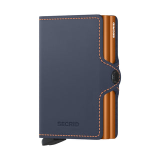 Secrid Twinwallet Matte in navy blue leather with contrasting orange aluminum card protector and stitching