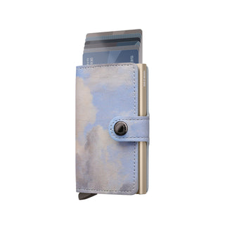 Secrid Miniwallet Art in soft blue cloud pattern Italian leather with cards partially ejected and snap closure