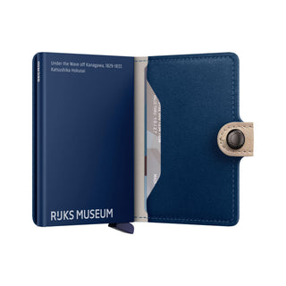 Secrid Miniwallet Art in blue Italian calf leather with beige snap closure, open showing card slots and design text