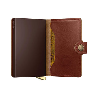 Secrid Miniwallet Basco open showing smooth brown vegetable-tanned leather with snap button closure