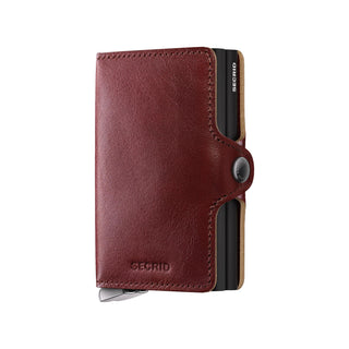 Secrid Twinwallet Basco in brown vegetable-tanned leather with button closure and card slots visible