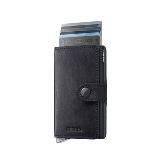 Secrid Miniwallet Basco in black vegetable-tanned leather with cards partially ejected and button closure