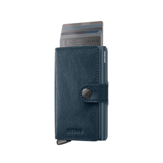 Secrid Miniwallet Basco in navy vegetable-tanned leather with embossed SECRID logo and card ejector visible
