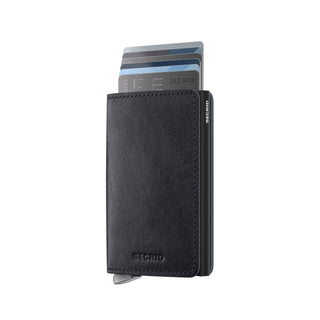 Secrid Slimwallet Basco in black vegetable-tanned leather holding multiple credit cards fanned out