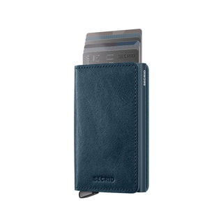 Secrid Slimwallet Basco in blue vegetable-tanned leather with cards partially ejected revealing embossed details
