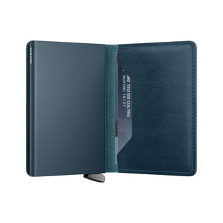 Secrid Slimwallet Basco in dark blue vegetable-tanned leather open showing card slot and metal case