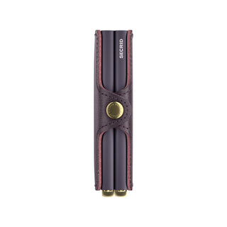 Secrid Twinwallet Basco in smooth dark purple leather with brass button and compact slim design