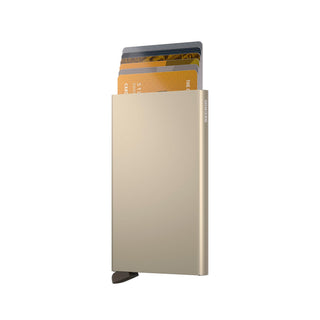 Secrid Cardprotector made of anodised aluminium in beige with cards partially ejected from the top