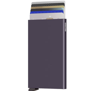 Secrid Cardprotector in matte dark purple anodised aluminum holding several cards partially extended