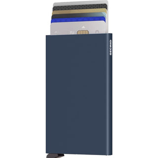 Secrid Cardprotector in matte navy blue anodised aluminium holding multiple credit cards fanned out