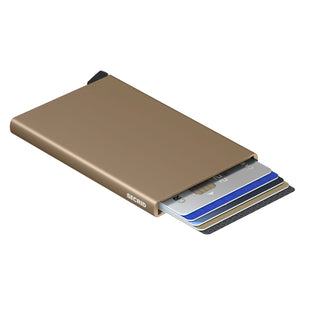 Secrid Cardprotector in matte bronze anodised aluminium with cards partially ejected from the slim wallet
