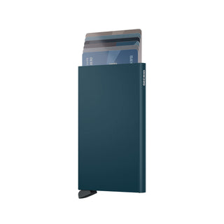 Secrid Cardprotector in dark teal anodised aluminium with cards partially ejected from top compartment