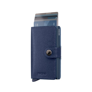 Secrid Miniwallet Crisple in blue European cowhide leather with cards partially ejected and button clasp closed