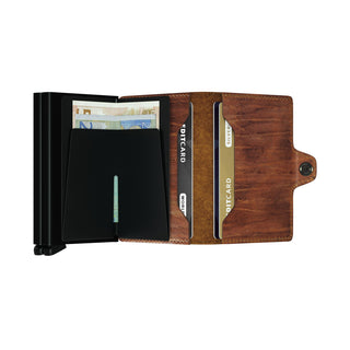 Secrid Twinwallet Dutch Martin open showing brown cowhide leather and black card compartments holding banknotes and cards