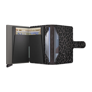 Secrid Miniwallet Leo with black leopard print cowhide and sleek metal card protector open with cash and cards
