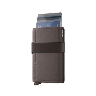 Secrid Bandwallet Liba non-leather wallet in brown with elastic band and cards partially extended