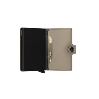 Secrid Miniwallet Matte open view showing black aluminum card protector and taupe leather exterior pocket