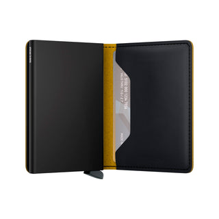 Secrid Slimwallet Matte open showing black European cowhide leather with yellow interior lining and card slot