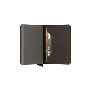 Secrid Slimwallet Matte open showing dark brown European cowhide exterior with card partially visible