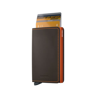 Secrid Slimwallet Matte in brown European cowhide leather with orange stitching and cards extended