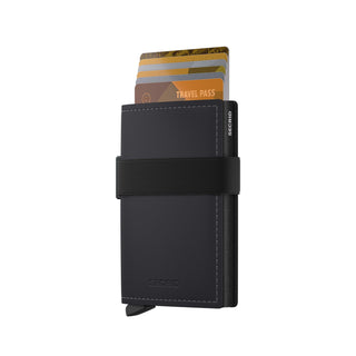 Secrid Bandwallet Matte leather wallet in black with elastic band and partially ejected cards visible