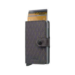 Secrid Miniwallet Optical in dark grey leather with geometric pattern and cards partially pulled out